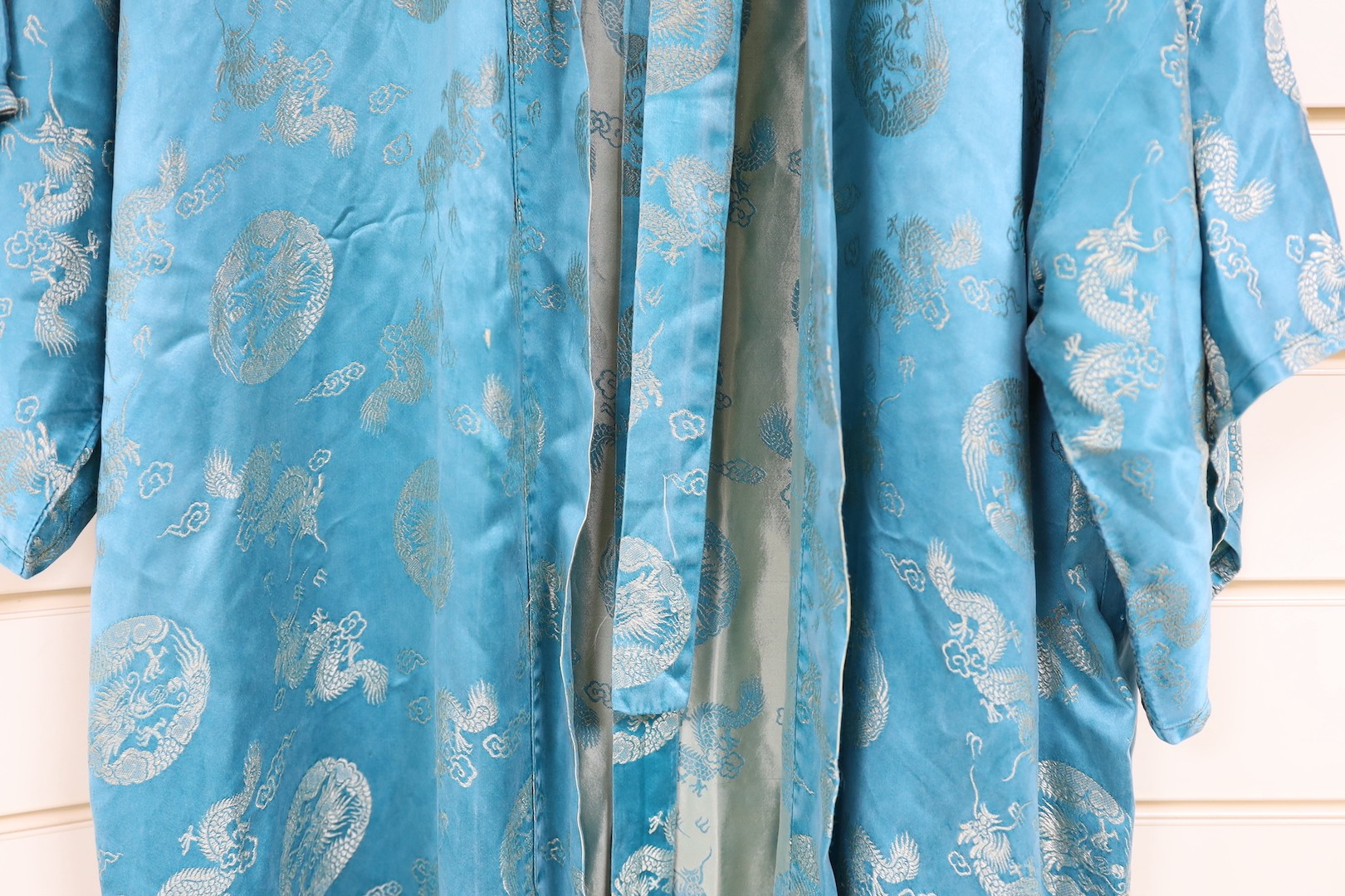 A 20th century Chinese blue brocade embroidered kimono with dragons